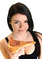 Young happy woman eating pizza, isolated on white
